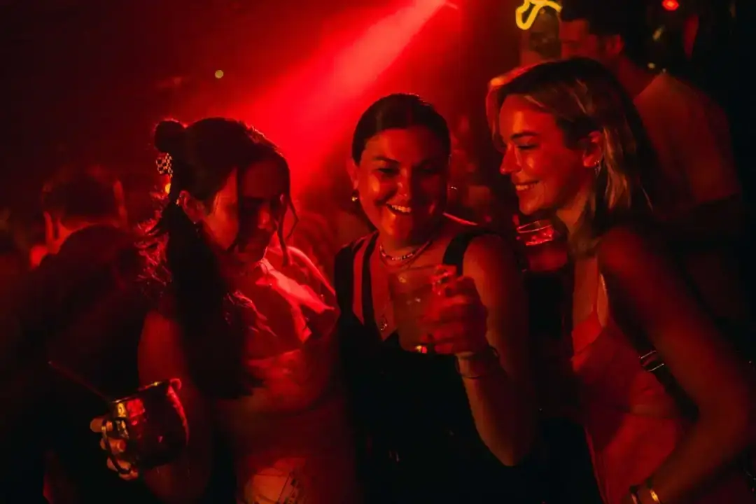 The dance floor at full tilt under red light