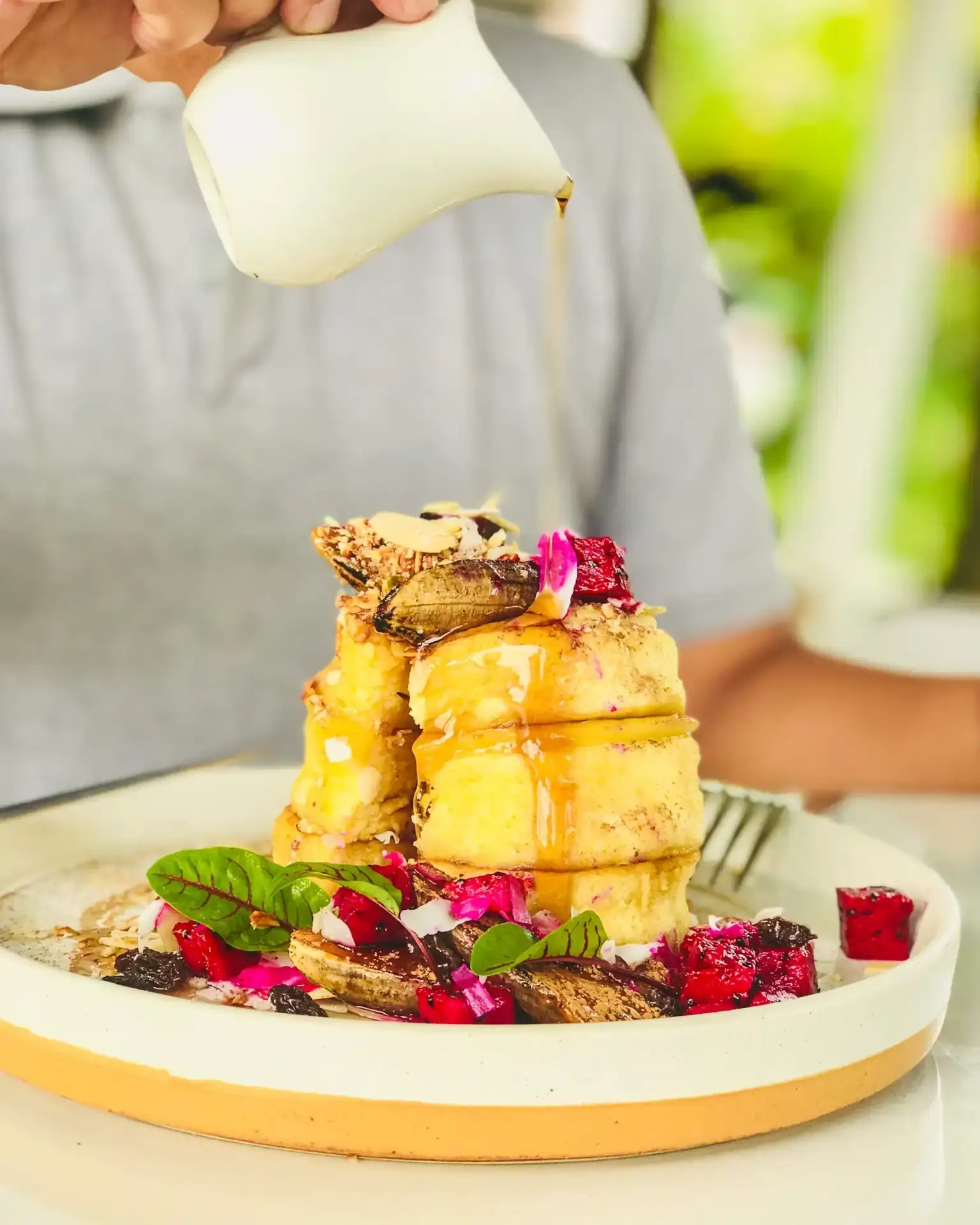 Stacked French toast with berries and flowers